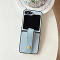 Detail of light blue litchi leather folding phone case with wrist strap and metal ring - Light Blue
