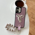 Detail of purple pleated leather phone case with silver bow and pearl wrist strap - Purple