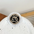 Detail of magnetic phone grip featuring gold bear emblem and sparkling rhinestones - Hollow Fat Bear (Black)