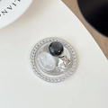 Close-up of sparkling rhinestone phone socket with marble bead and silver star accent - Silver Series No. 6