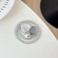 Detail of round rhinestone phone grip with silver heart and resin stone accents - Silver Series No. 9