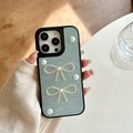 Detail of light blue wrinkled texture phone case with pearl bowknot and black soft bumper - Large-hole Pearlescent Texture - Two Pearl And Rhinestone Bows - Blue / iPhone X/XS