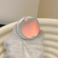 Macro detail of apple-shaped holographic phone grip with Gift For You engraved base - Magnetic Aurora Blue Apple