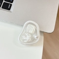White flower cell phone grip with pearls and sequins shown next to a laptop - Irregular Ring - Glitter Cat Eye Flower - White