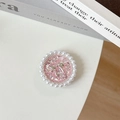 Detail of a pink glitter phone grip with silver bow and pearl ring on white background - Glitter Pink / Transparent Stand