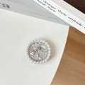Macro detail of round phone grip with white pearls and silver glitter bow design - Glitter Silver / Transparent Stand