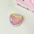 Nahaufnahme einer herzförmigen Handyhalterung mit rosa und gelbem Glitzer und Pailletten - Magnetisch-Kristallglas Herz-Bunt Irisierend