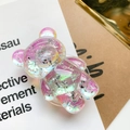 Close-up of iridescent purple bear phone grip with sparkling silver flakes and glossy finish - Bear Grip-Silver Foil-Rainbow Laser
