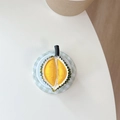 Macro shot of 3D durian phone socket grip featuring realistic yellow pulp and green thorns - Durian Style (Grey Green)