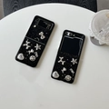 Detail of glitter black folding case with silver star and smiley face metal charms - Black Star Glitter Rose Smiley Dog / Samsung Z Flip 3