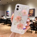 Detail of clear iPhone case with real pink pressed flowers and shimmering glitter - Real Pink Flowers / iPhone 7/8/SE 2020