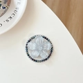 Macro view of magnetic phone socket featuring a translucent flower with pearly beads - Silver Gray Sakura Cat Paw