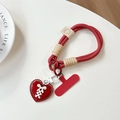 Nahaufnahme der roten geflochtenen Handy-Handschlaufe mit Herzanhänger und Metallschnalle - Smile Kurzes Seil + Roter Patch + Gebundenes Herz / Rot