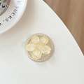 Close-up of translucent yellow flower phone grip with small gold bead trim detail - Yellow Glitter Sakura Cat Paw