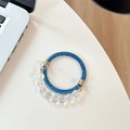 Dettaglio della base glitterata blu scuro per supporto telefono con catena di cristalli - Glitter Blu + Catena di Cristallo Blu