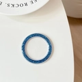 Macro shot of circular dark blue glitter phone socket base with silver metallic frame - Blue