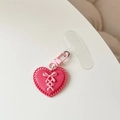 Détail du porte-clés cœur rose avec nœud et attache transparente pour téléphone - Breloque coeur / Rouge Rose