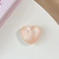 Detail view of a 3D glitter peach pink heart phone grip with pearlescent finish - Matte Heart Holder-Cloud Glitter Orange