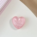 Pink glittery heart-shaped phone grip showing a pearlescent finish on a white surface - Matte Heart Holder-Cloud Glitter Red
