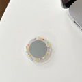 Macro view of a round acrylic mirror phone socket with colorful polka dots on a white desk - Epoxy Stand - Color Polka Dot Mirror - Transparent