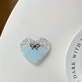 Glittery heart phone grip with black bow detail on a clean white aesthetic background - Resin Blue Gradient Heart Bow