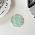 Detail of round phone socket holder with turquoise glitter and pearl border on white desk - No.6 Double Green (Pearl Magnetic Macaron Sequin)
