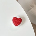Detail of red rhinestone heart with white plush trim and luxury textured surface - Plush Rhinestone Heart Shape / Red