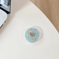 Macro shot of mint green phone grip with heart mirror and colorful sequins on white desk - Transparent Epoxy - Colorful Polka Dot Heart - Blue Light