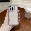 Detail of purple wavy glitter phone case with clear back held over a wooden table - Purple Glitter Edge / iPhone 16e