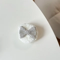 Detailed view of a white plush circular grip featuring a sparkling rhinestone bow - Plush Rhinestone Bowknot Shape / White