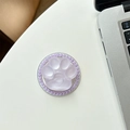 Close-up of purple cat paw magnetic phone grip with beaded edges and heart detail - Shimmering Purple