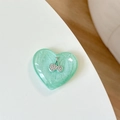 Detail of mint green resin heart phone grip featuring a sparkling rhinestone cherry design - Green Glitter (3D Heart Rhinestone Cherry)