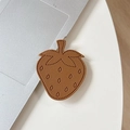 Detail shot of brown leather strawberry phone socket with premium stitching texture - Brown