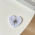 Macro detail of silver star-shaped pendant on glittery heart mirror accessory - Starry Silver Foil Meteor #1 / White