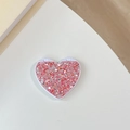 Macro shot of a heart-shaped glitter makeup mirror with a foldable white plastic frame - Flip Heart Mirror - High Glitter / Red