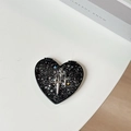 Close-up of black heart-shaped portable mirror with silver glitter and Y2K star charms - Starry Silver Foil Meteor #1 / Black