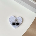 Detail of creative cherry phone mirror charm with black glitter beads and silver stem leaf - Starry Silver Foil Cherry #2 / White