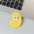 Macro detail of yellow leather phone grip showing stitched edges and embossed text - Leather Mango (Big Eyes) / Yellow