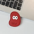 Macro detail of red faux leather phone grip with cute eyes and C'est la vie embossing - Leather Mango (Big Eyes) / Burgundy