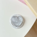 Detail of grey heart-shaped phone grip with Gift For You text on a white base - Cloud Flash Grey