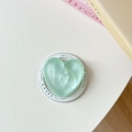 Detail of mint green heart phone socket with pearl luster and 'Gift For You' text - Shimmering Green