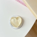 Detail of a cream heart magnetic phone socket with pearl texture and Gift For You text - Shimmering Yellow