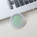 Detail of a round clear phone socket featuring colorful mint and yellow glitter sequins - Double Green (No.6)