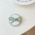 Detail of magnetic phone socket with green fabric bow and grey plaid pattern base - Checkered Film Magnetic Diagonal Bow / Green