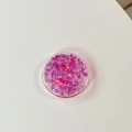 Close-up of a round phone grip featuring pink butterfly sequins and holographic glitter - Gradient Butterfly - Laser Pink