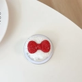 Detail of red rhinestone bow decoration on white plush phone grip base for women - Plush Rhinestone Round Bowknot / Red