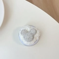 Detail of Mickey-shaped phone grip with sparkling white rhinestones and plush white fur - Plush Rhinestone Mouse Head Shape / White