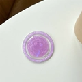 Vista macro del soporte para móvil violeta con textura de concha y purpurina irisada - Púrpura Metálico