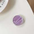 Detail view of round purple marble phone grip with silver flakes and glossy resin finish - Light Purple
