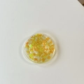 Round phone grip featuring orange maple leaf sequins embedded in clear resin - Gradient Butterfly - Laser Yellow